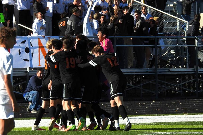 Teton boys soccer celebrates a goal during their state championship win over Sugar-Salem