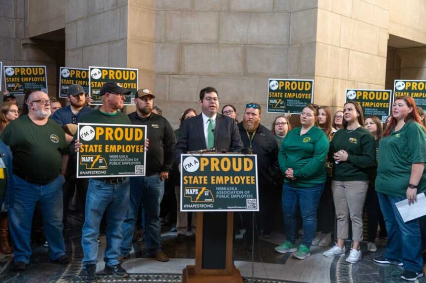 Justin Hubly, executive director of the Nebraska Association of Public Employees, leads a news conference in December 2023 in Lincoln. New national research found high levels of job satisfaction among public employees, but high levels of burnout and harassment at work. | Courtesy Zach Wendling / Nebraska Examiner
