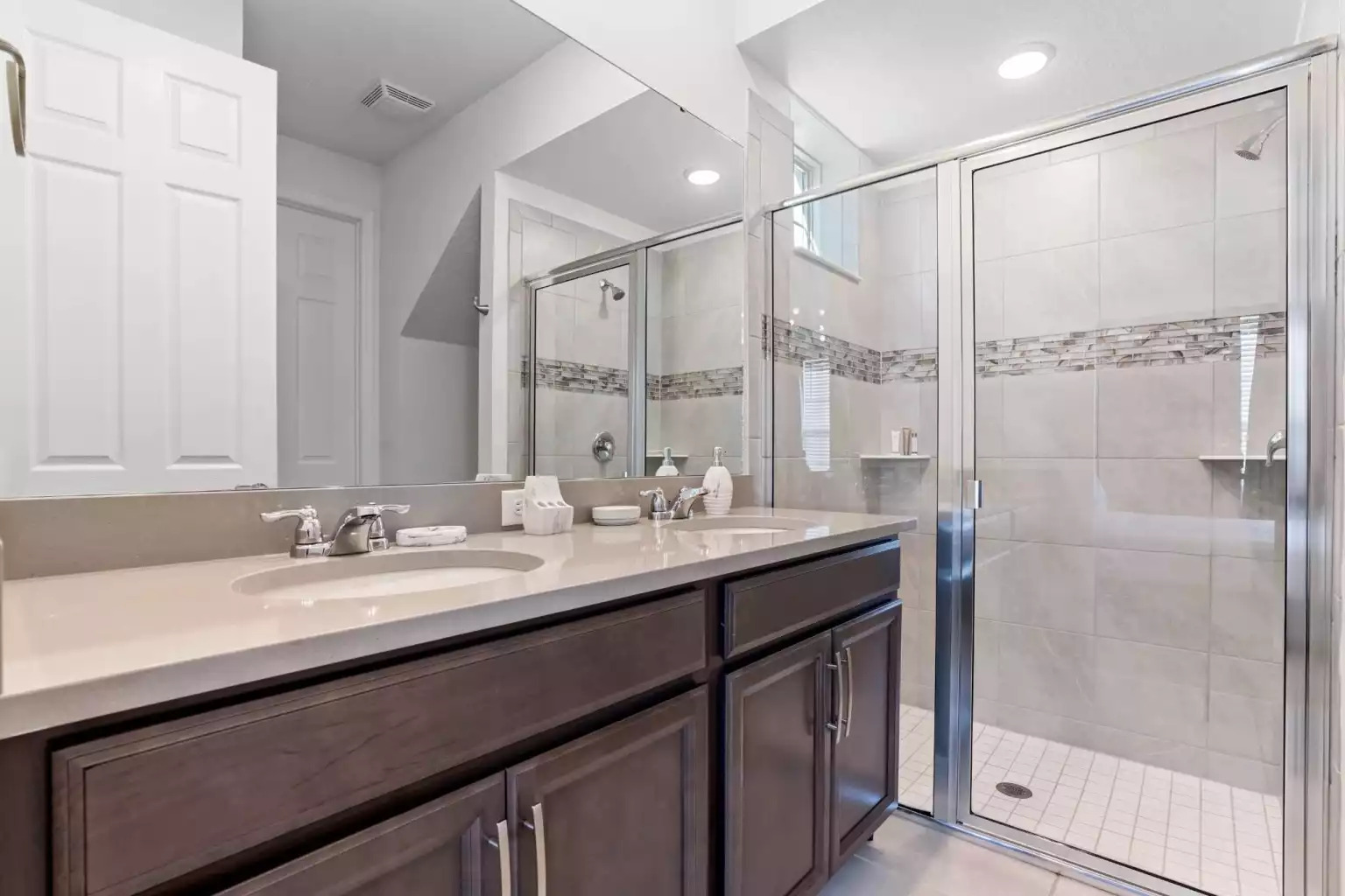 Full bathroom with walk in shower, large mirror and vanity. Full bathroom with walk in shower, large mirror and vanity. - Luxury Vacation Home Minutes From Disney World - Kissimmee
