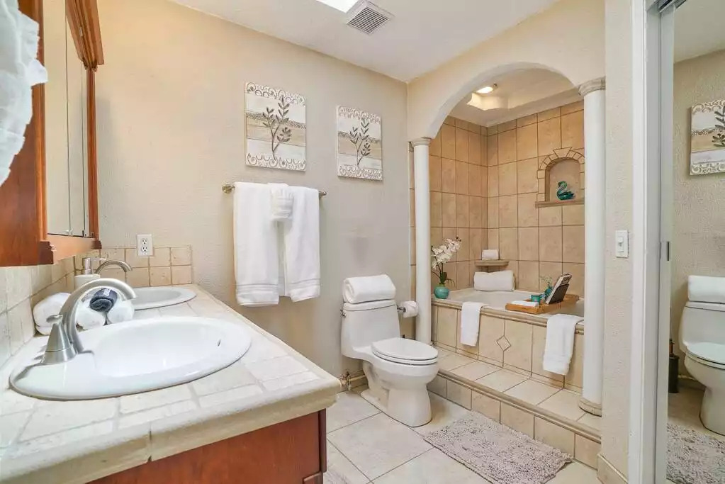Spa-inspired Master bathroom with jet tub and fluffy white towels. Spa-inspired Master bathroom with jet tub and fluffy white towels. - Heated Saltwater Pool*Harry Potter*Fire Pit*BBQ*EV - St. Augustine