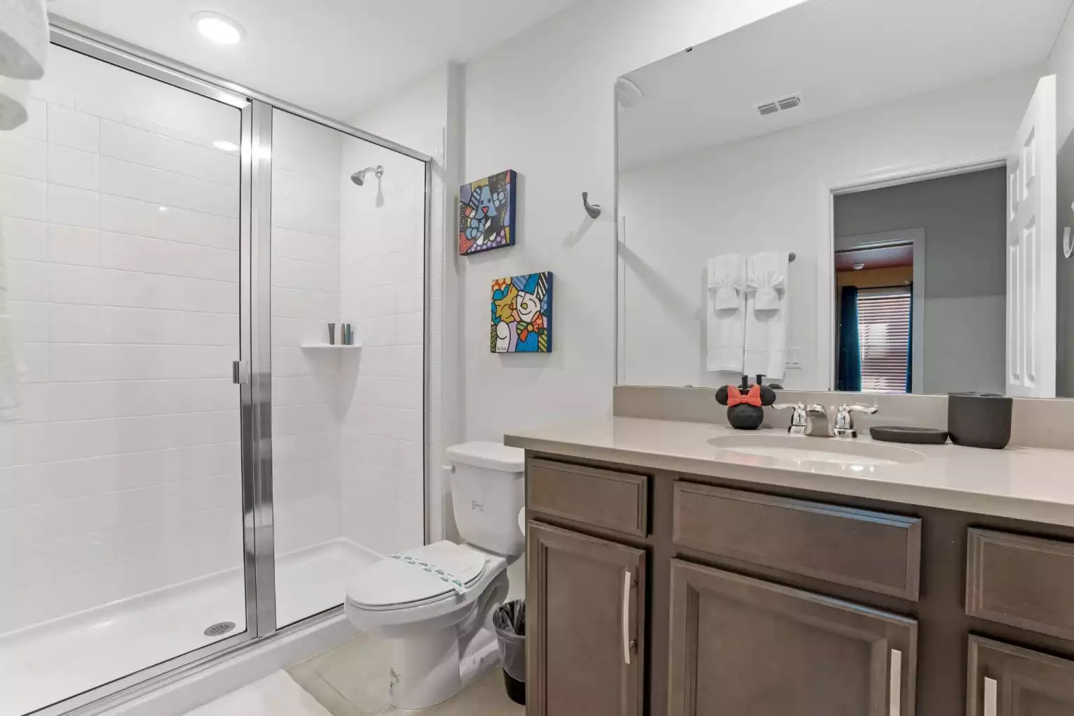 Full bathroom with walk in shower, large mirror and vanity. Full bathroom with walk in shower, large mirror and vanity. - Luxury Vacation Home Minutes From Disney World - Kissimmee
