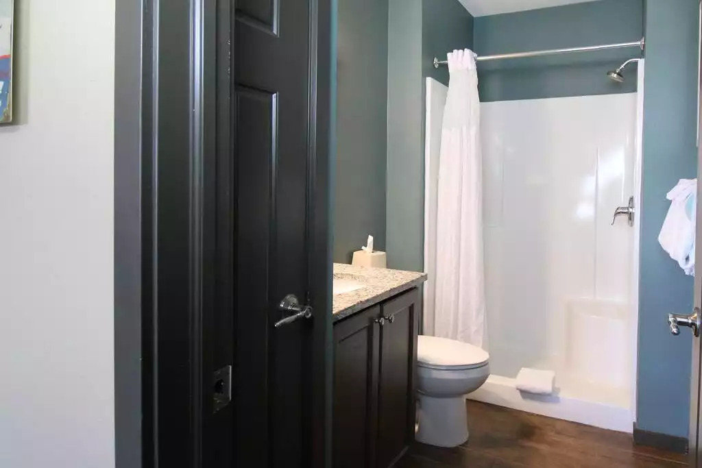 This guest bath includes shower stall, granite countertop, magnified make up mirror, and vanity storage. The cabin includes 6 bath towels, hand towels and wash cloths. Hair dryer, soap, lotion, shampoo and conditioner are included. This guest bath includes shower stall, granite countertop, magnified make up mirror, and vanity storage. The cabin includes 6 bath towels, hand towels and wash cloths. Hair dryer, soap, lotion, shampoo and conditioner are included. - Entire Cabin 1 Wisc Dells 3 Beds(2Bedrooms) 2Baths - 63 Christmas Mountain Road