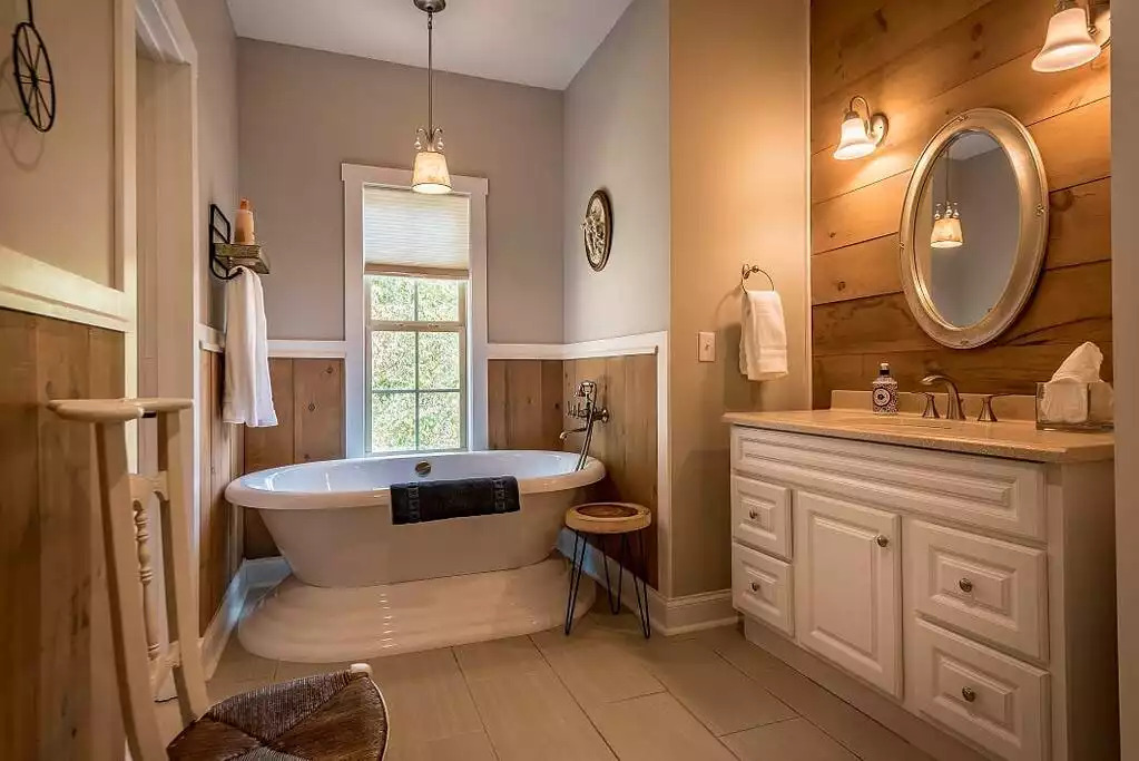 Guest bathroom with free-standing, luxury soaking bathtub. We provide complimentary facial cleanser, cotton rounds, and hand soap. Guest bathroom with free-standing, luxury soaking bathtub. We provide complimentary facial cleanser, cotton rounds, and hand soap. - Fox View Cottage - Rising Fawn