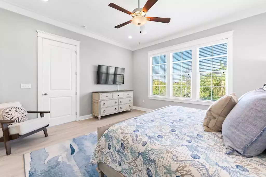 The master bedroom includes a 55" Smart TV, coastal decor & plenty of storage - 2 night stands, dresser and huge walk in closet! The master bedroom will provide guests a peaceful, refreshing retreat! The master bedroom includes a 55" Smart TV, coastal decor & plenty of storage - 2 night stands, dresser and huge walk in closet! The master bedroom will provide guests a peaceful, refreshing retreat! - Shipwrecked Beach House Orange Beach, Alabama - Orange Beach