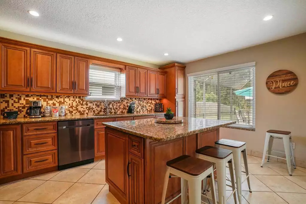 Fully equipped kitchen with an island. Fully equipped kitchen with an island. - Heated Saltwater Pool*Harry Potter*Fire Pit*BBQ*EV - St. Augustine