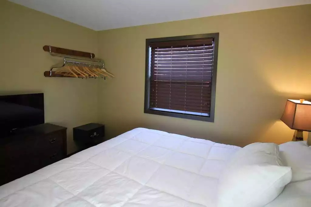 Master bedroom contains dresser, spot for hanging clothes, safe, smart TV with free cable, two night stands with lamps, clock radio and in room safe. Master bedroom contains dresser, spot for hanging clothes, safe, smart TV with free cable, two night stands with lamps, clock radio and in room safe. - Entire Cottage 1 Wisc Dells 2 Bed 1 Bath Sleeps 6 - Wisconsin Dells