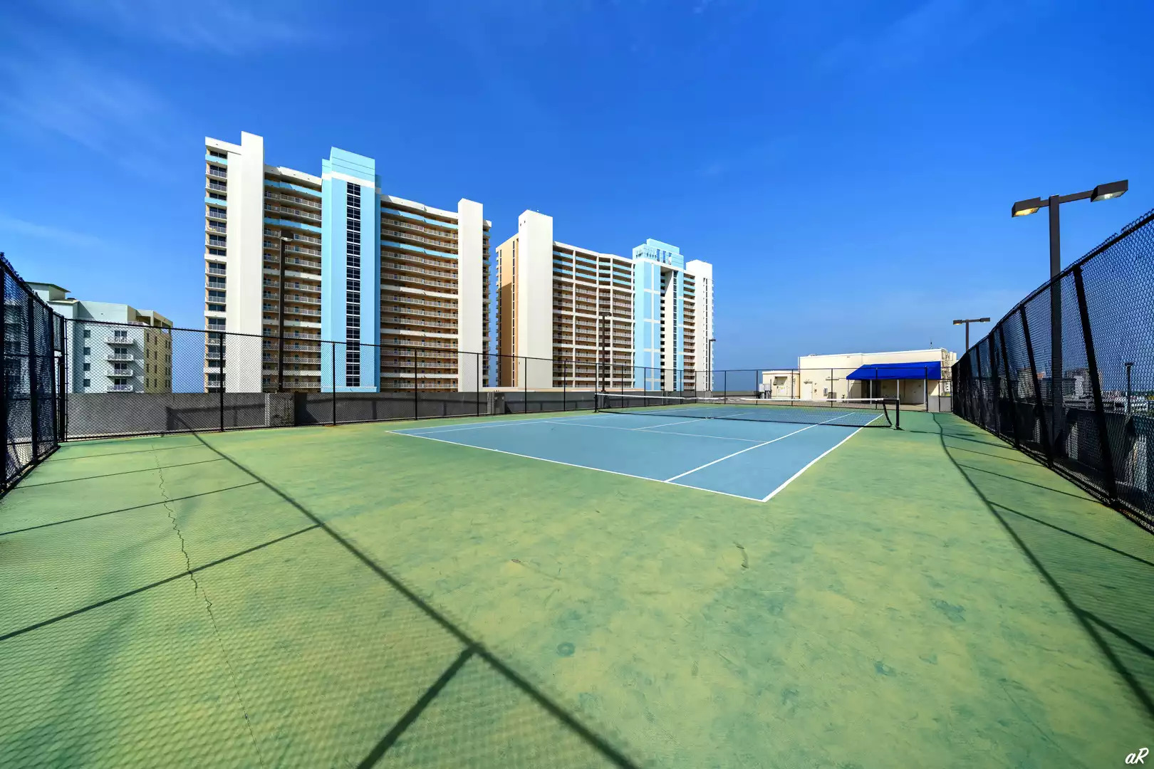 Tennis courts atop parking garage Tennis courts atop parking garage - BeachVacationHub Majestic 2203 PCB - Panama City Beach