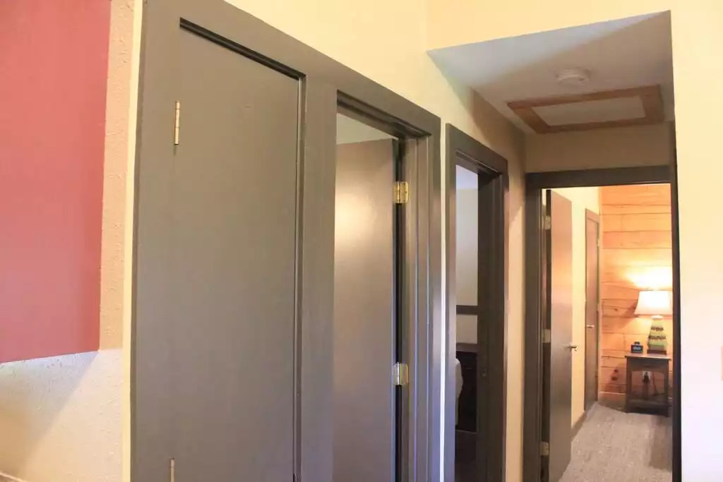 This photo, taken just outside the kitchen, looks straight down into the master bedroom. Bathroom and second bedroom doors are on our left, along with hall closet. Short hallway is easily accessible to bedrooms. This photo, taken just outside the kitchen, looks straight down into the master bedroom. Bathroom and second bedroom doors are on our left, along with hall closet. Short hallway is easily accessible to bedrooms. - Entire Cabin 3 Wisc Dells 3 Beds(2Bedrooms) 2Baths - Wisconsin Dells
