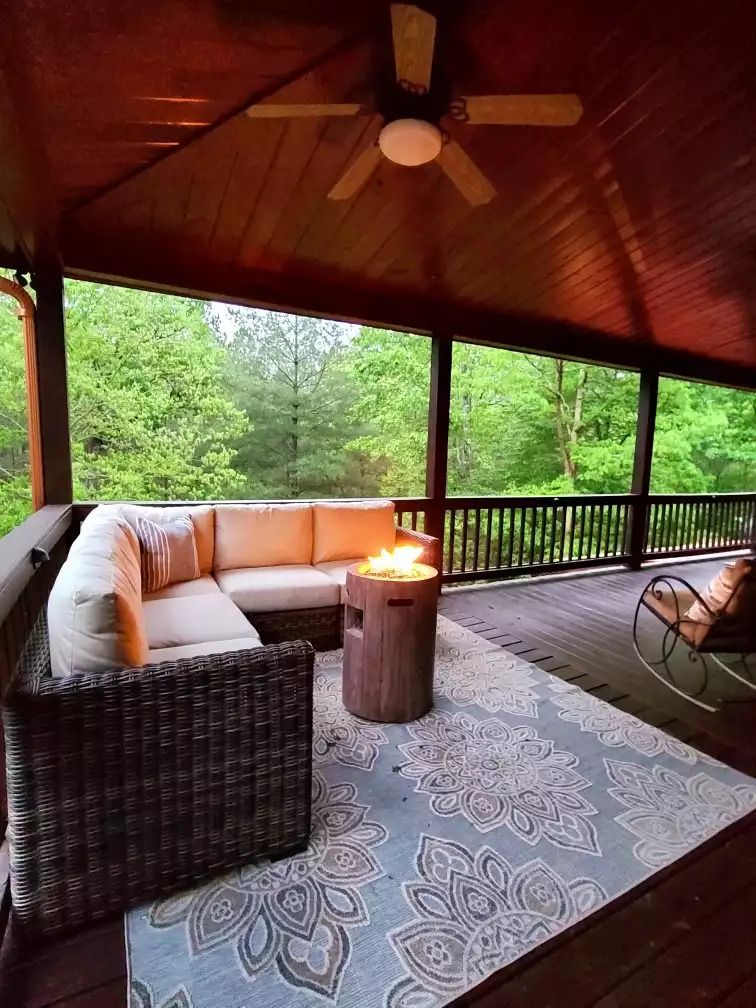 The feeling of being in a treehouse. During the winter when the trees are bare, you can get a slight moubtain glimpse from the front porch.