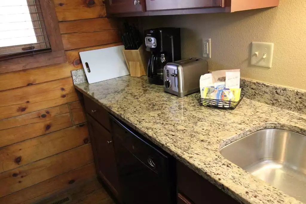 This well equipped kitchen is fully stocked with coffee pot, blender, knife set, toaster, pots and pans, hot pad holders, in addition to dishes, glasses, dish soap, towels, salt/pepper, popcorn and coffee for your stay. This well equipped kitchen is fully stocked with coffee pot, blender, knife set, toaster, pots and pans, hot pad holders, in addition to dishes, glasses, dish soap, towels, salt/pepper, popcorn and coffee for your stay. - Entire Cabin 1 Wisc Dells 3 Beds(2Bedrooms) 2Baths - 63 Christmas Mountain Road