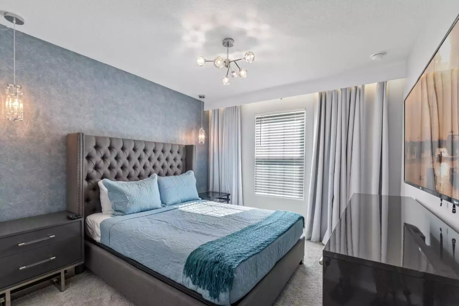 Bedroom with queen bed, decorative wallpaper, modern lighting and smart tv. Bedroom with queen bed, decorative wallpaper, modern lighting and smart tv. - Luxury Vacation Home Minutes From Disney World - Kissimmee