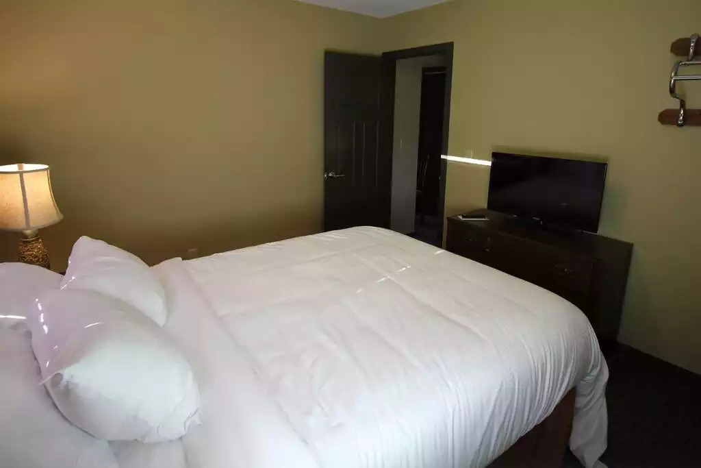 Cottage guest bedroom contains queen bed, dresser, two night stands and smart TV with free cable. Did we mention how comfortable the beds are? You have to try them for yourself! Cottage guest bedroom contains queen bed, dresser, two night stands and smart TV with free cable. Did we mention how comfortable the beds are? You have to try them for yourself! - Entire Cottage 1 Wisc Dells 2 Bed 1 Bath Sleeps 6 - Wisconsin Dells