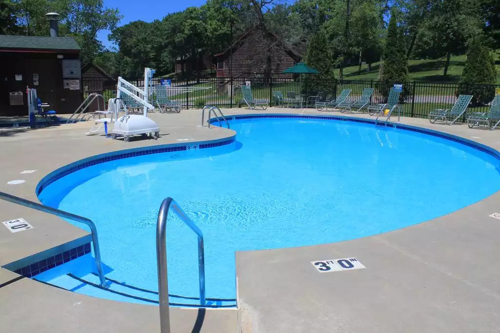 With plenty of seating around the pool, there is room to watch the kids swim, or get a little sun. Outdoor pools are open 10 AM to 8 PM. This is one of four outdoor pools on the property. And the one closest to your cabin! With plenty of seating around the pool, there is room to watch the kids swim, or get a little sun. Outdoor pools are open 10 AM to 8 PM. This is one of four outdoor pools on the property. And the one closest to your cabin! - Entire Cabin 1 Wisc Dells 3 Beds(2Bedrooms) 2Baths - 63 Christmas Mountain Road