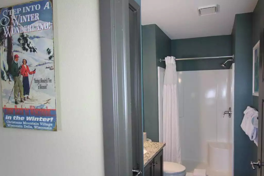 This guest bath includes shower stall, granite countertop, and vanity storage. The cabin includes 6 bath towels, hand towels and wash cloths. Hair dryer, soap, lotion, make up wipes, shampoo and conditioner are included. This guest bath includes shower stall, granite countertop, and vanity storage. The cabin includes 6 bath towels, hand towels and wash cloths. Hair dryer, soap, lotion, make up wipes, shampoo and conditioner are included. - Entire Cabin 1 Wisc Dells 3 Beds(2Bedrooms) 2Baths - 63 Christmas Mountain Road