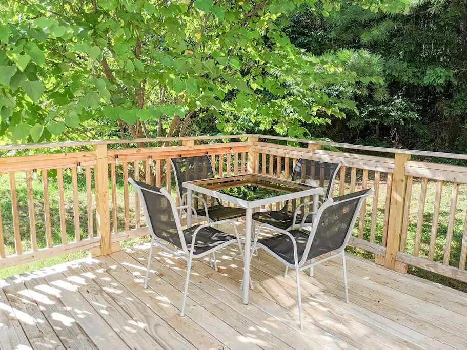 Enjoy the shade of this giant red bud tree on the deck. Enjoy the shade of this giant red bud tree on the deck. - Modern TN Farmhouse at Lake Chickamauga w/ WiFi - Decatur