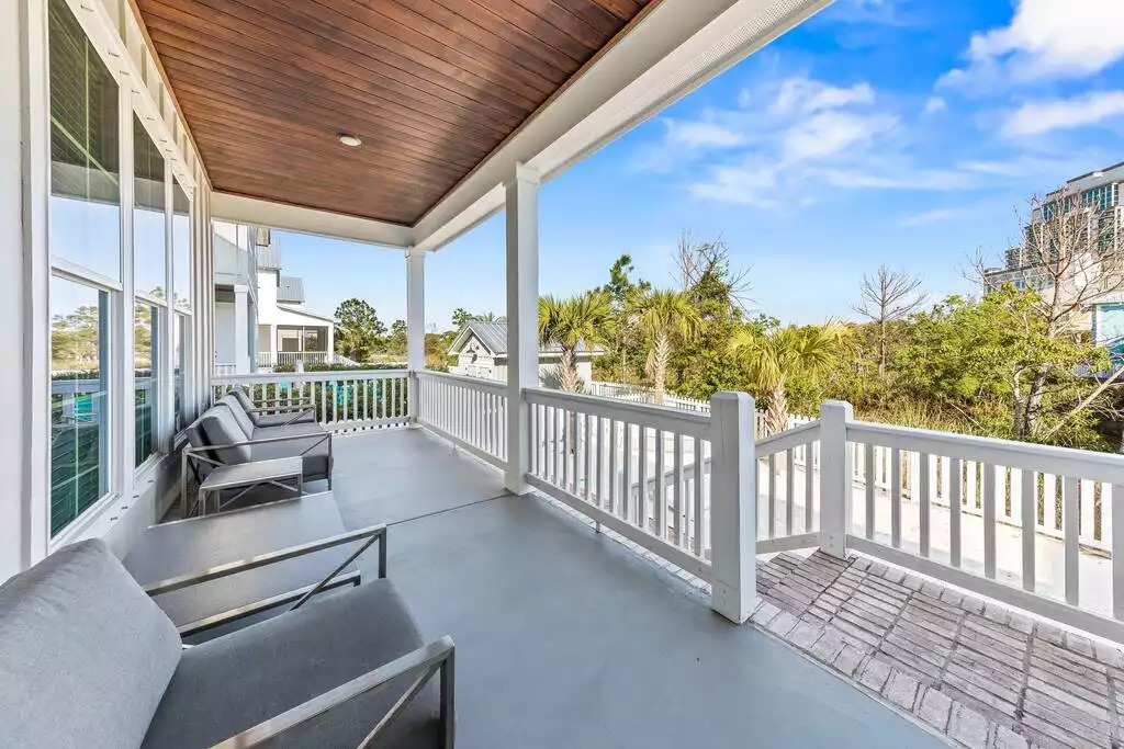 Relax on the back porch and enjoy an Orange Beach sunset! The porch overlooks the sandy backyard, grill, corn hole game and the 2 oversized hammocks. The fenced in backyard also backs up to a canal of water providing even more privacy & beauty! Relax on the back porch and enjoy an Orange Beach sunset! The porch overlooks the sandy backyard, grill, corn hole game and the 2 oversized hammocks. The fenced in backyard also backs up to a canal of water providing even more privacy & beauty! - Shipwrecked Beach House Orange Beach, Alabama - Orange Beach
