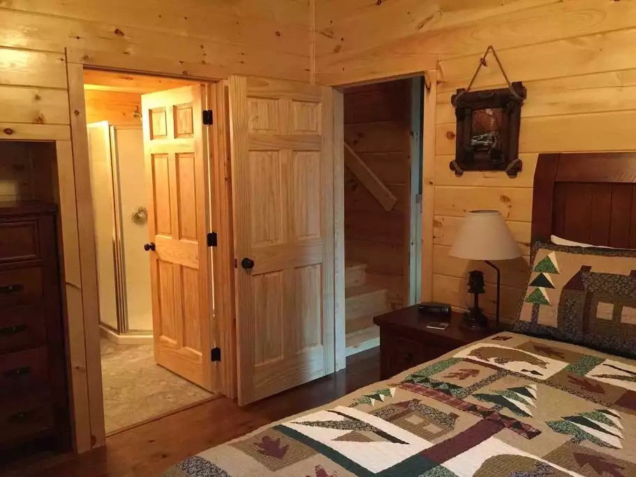 Another view of Lower Level Bedroom showing bathroom entrance Another view of Lower Level Bedroom showing bathroom entrance - Secluded Luxury 2 Bdrm Cabin w/Theatre Room & Pond - Sevierville