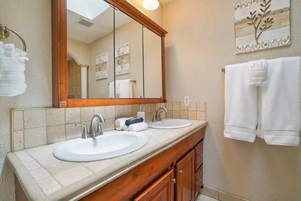 Master bedroom with double vanity. Master bedroom with double vanity. - Heated Saltwater Pool*Harry Potter*Fire Pit*BBQ*EV - St. Augustine