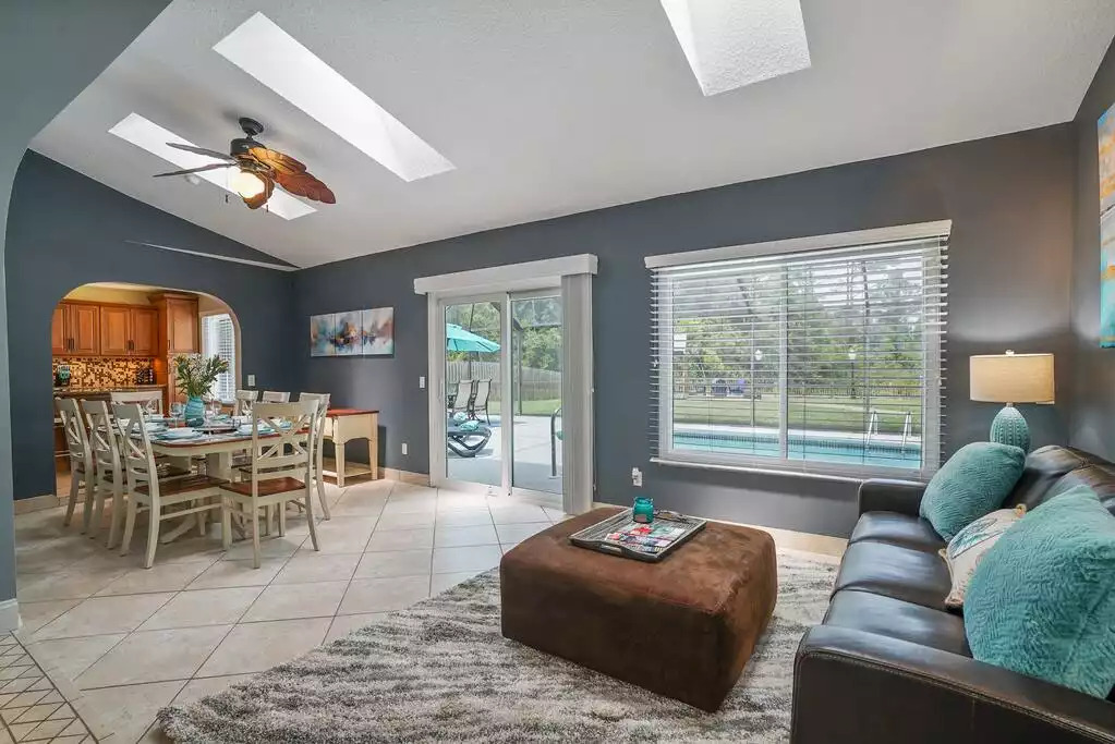 Dining room and living areas overlooking the pool. Dining room and living areas overlooking the pool. - Heated Saltwater Pool*Harry Potter*Fire Pit*BBQ*EV - St. Augustine