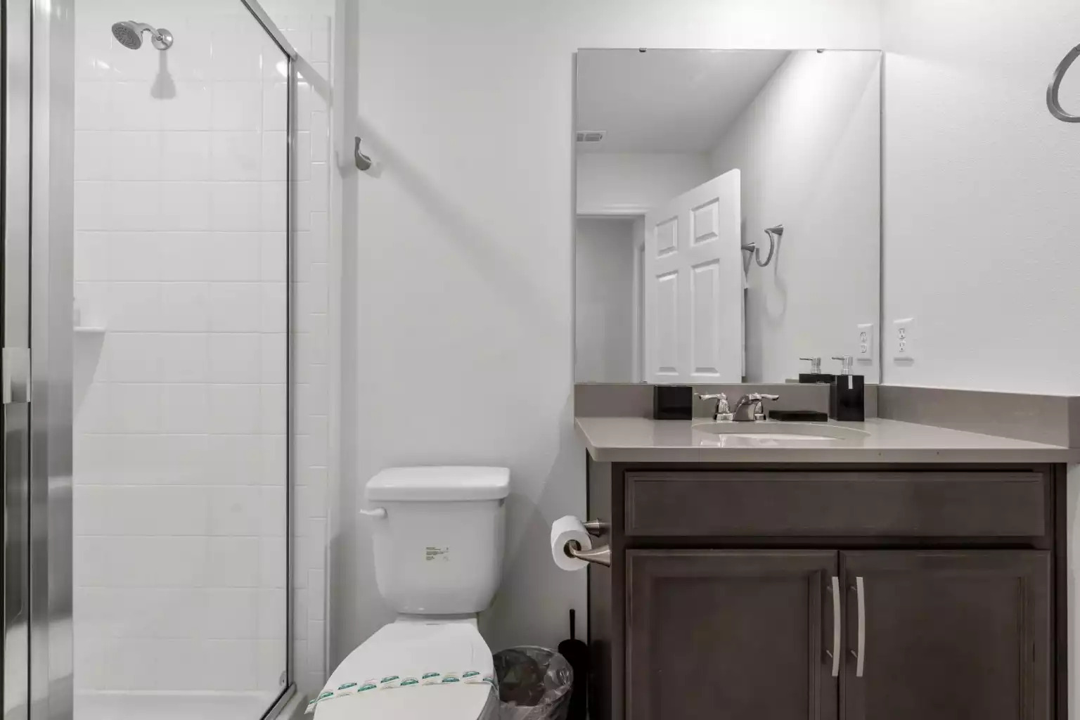 Full bathroom with walk in shower, large mirror and vanity. Full bathroom with walk in shower, large mirror and vanity. - Luxury Vacation Home Minutes From Disney World - Kissimmee