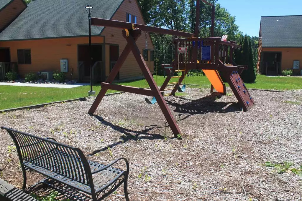 This play area for the kids (or adults, we don't judge), is located just outside of the pool. All within walking distance of your cabin. This play area for the kids (or adults, we don't judge), is located just outside of the pool. All within walking distance of your cabin. - Entire Cabin 1 Wisc Dells 3 Beds(2Bedrooms) 2Baths - 63 Christmas Mountain Road