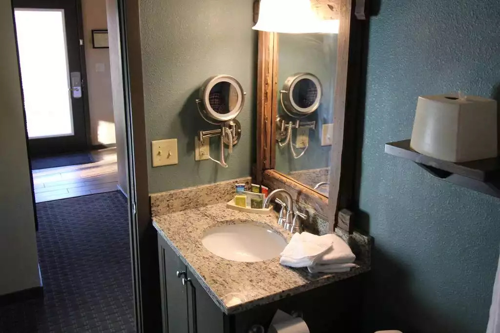 This beautiful bathroom has cabin décor yet modern, updated materials. With linens included, and basic toiletries, including Kleenex and toilet paper, you will soon feel very at home in your cottage rental! This beautiful bathroom has cabin décor yet modern, updated materials. With linens included, and basic toiletries, including Kleenex and toilet paper, you will soon feel very at home in your cottage rental! - Entire Cottage 1 Wisc Dells 2 Bed 1 Bath Sleeps 6 - Wisconsin Dells
