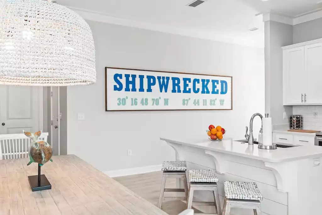 “Shipwrecked” is beautifully designed & decorated by Mint Decor! This oversized latitude & longitude coordinates wall art is just one of the many unique finishings guests can enjoy! “Shipwrecked” is beautifully designed & decorated by Mint Decor! This oversized latitude & longitude coordinates wall art is just one of the many unique finishings guests can enjoy! - Shipwrecked Beach House Orange Beach, Alabama - Orange Beach