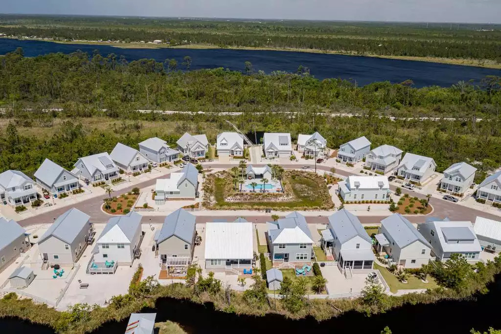 This is an aerial view of the Park's Edge community in Orange Beach and view of "Shipwrecked" & the sandy private fenced in backyard backing up to the canal of water & the community's direct access to 25+ miles of trails of the Gulf State Park! This is an aerial view of the Park's Edge community in Orange Beach and view of "Shipwrecked" & the sandy private fenced in backyard backing up to the canal of water & the community's direct access to 25+ miles of trails of the Gulf State Park! - Shipwrecked Beach House Orange Beach, Alabama - Orange Beach