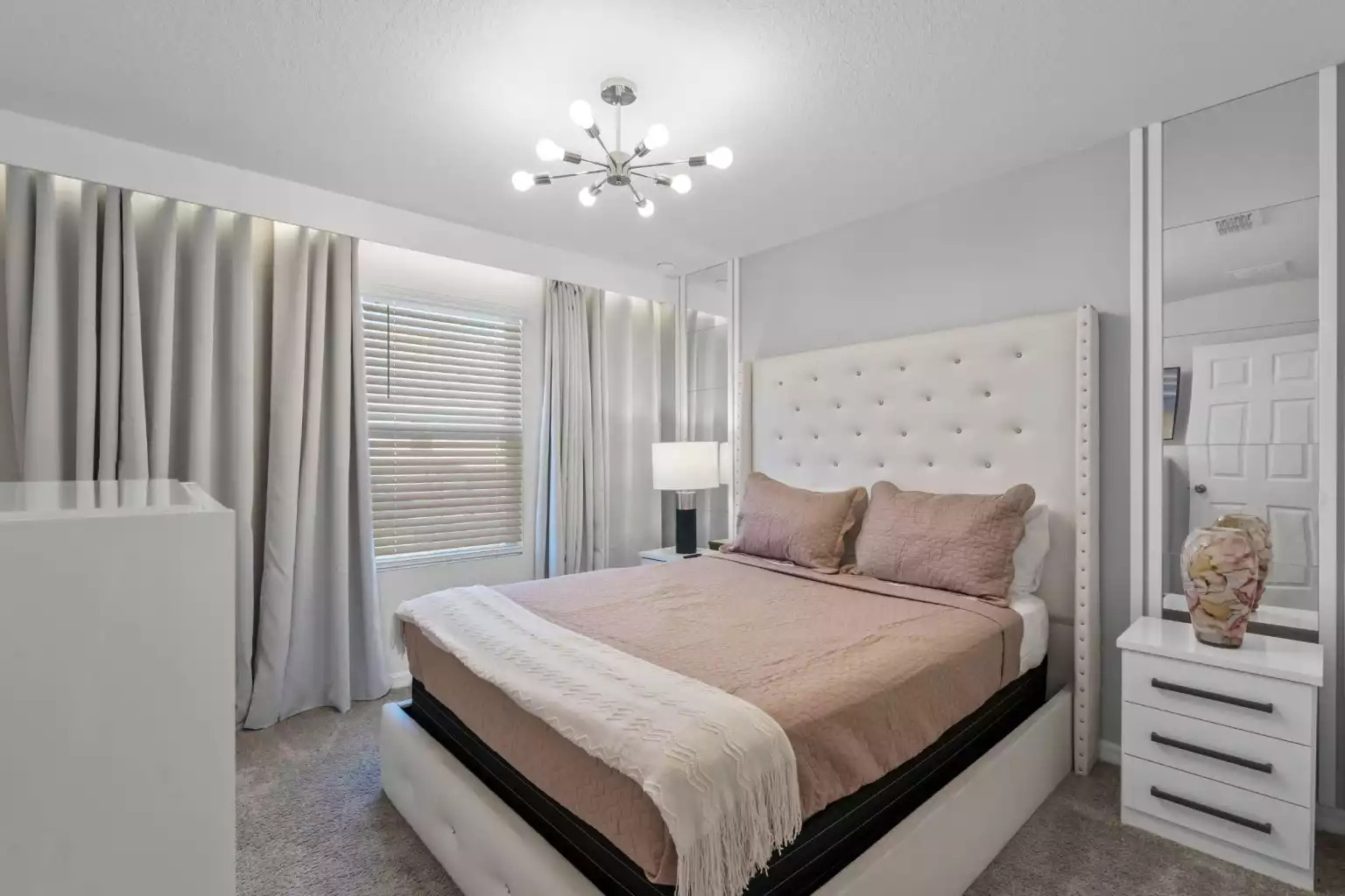 Bedroom with queen bed, modern lighting, dresser, end tables and smart tv. Bedroom with queen bed, modern lighting, dresser, end tables and smart tv. - Luxury Vacation Home Minutes From Disney World - Kissimmee