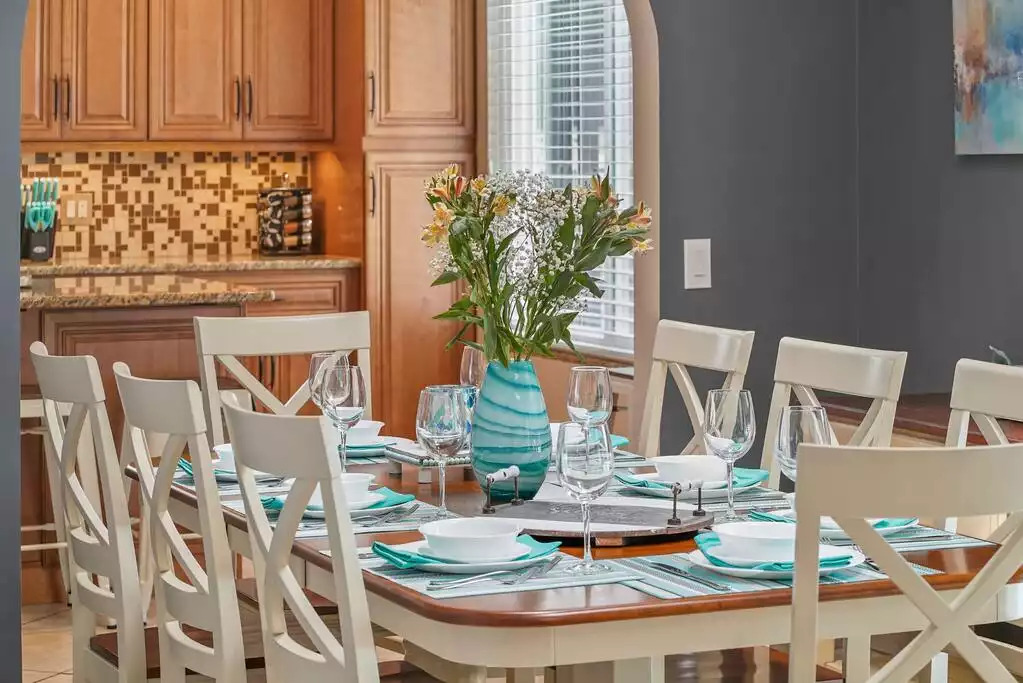 Elegant dining room setting for 12 people with classic Corelle white dinnerware. Elegant dining room setting for 12 people with classic Corelle white dinnerware. - Heated Saltwater Pool*Harry Potter*Fire Pit*BBQ*EV - St. Augustine