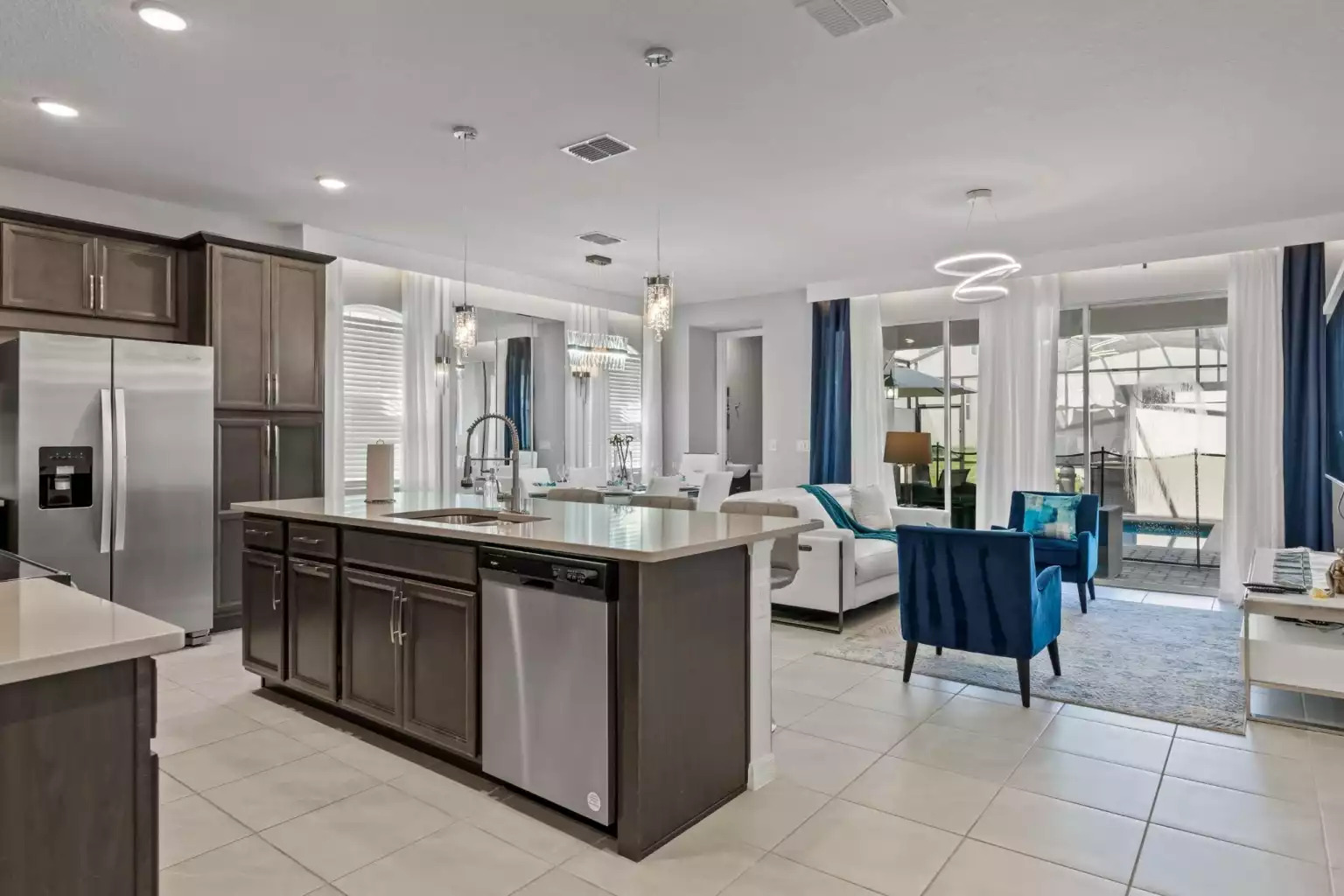 Full kitchen with stainless steel dishwasher, microwave, refrigerator and island. Full kitchen with stainless steel dishwasher, microwave, refrigerator and island. - Luxury Vacation Home Minutes From Disney World - Kissimmee