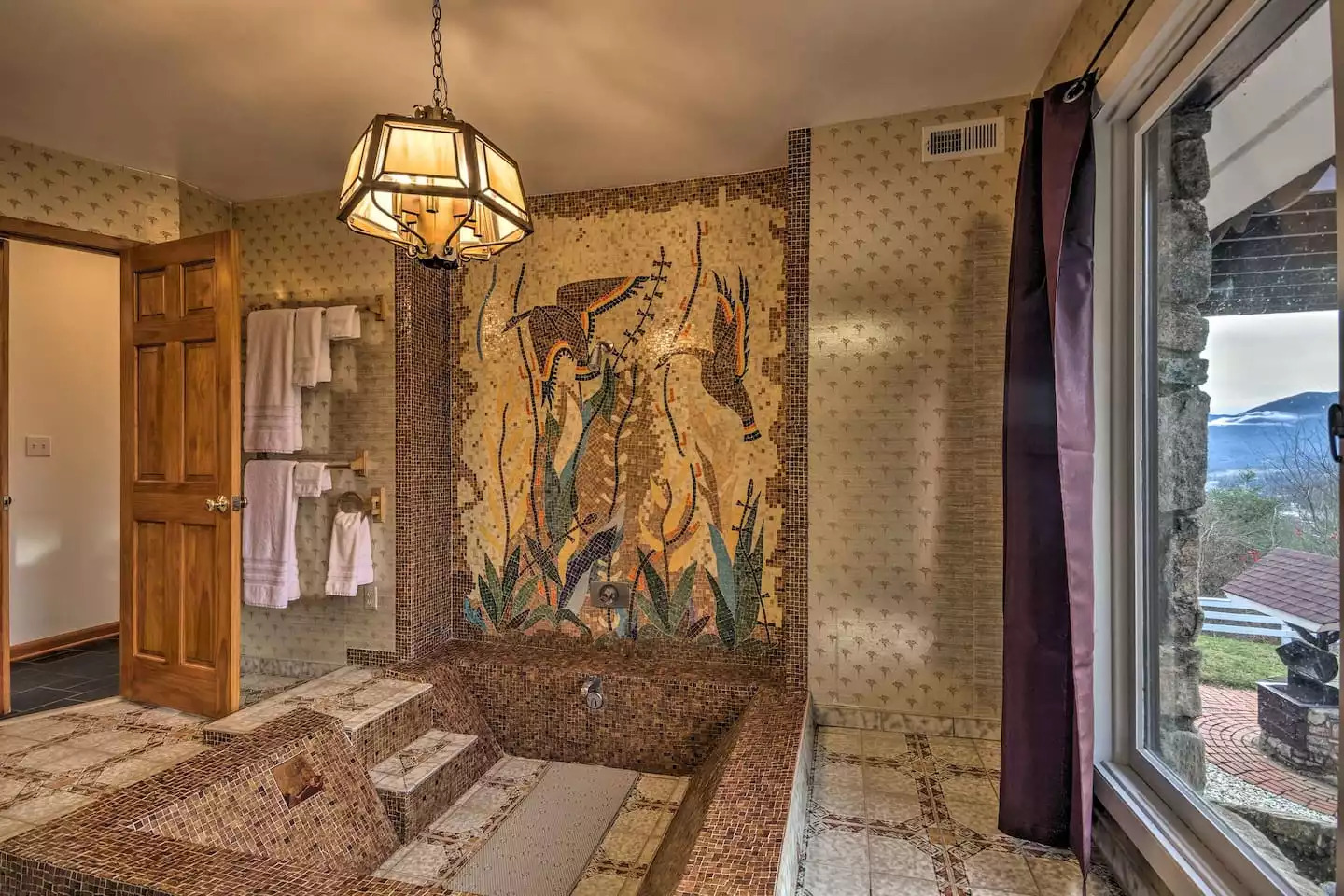 This unforgettable mosaic inset bathtub will help you bathe in luxury. This unforgettable mosaic inset bathtub will help you bathe in luxury. - Leaping Fawn Lodge - Waynesville