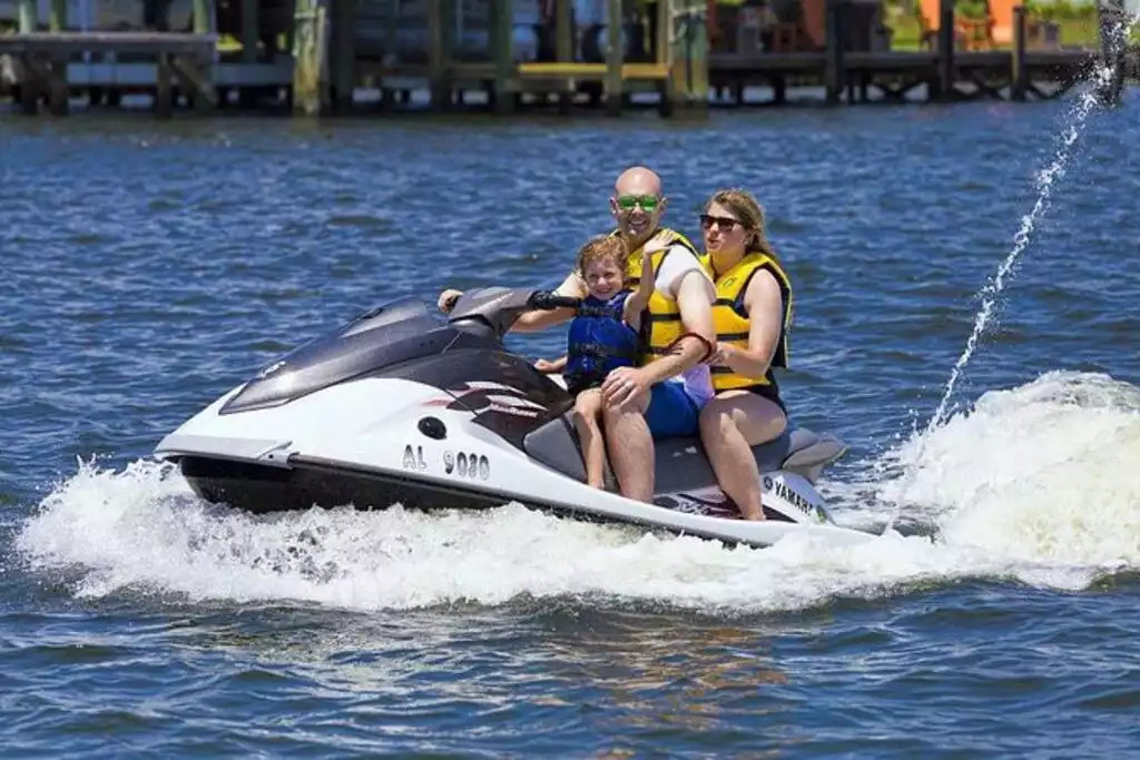 Jet skiing provides a fun and unique opportunity to explore the Gulf and Bay of Orange Beach! Don't be surprised if you find that some dolphins want to keep you company on your adventure! Jet skiing provides a fun and unique opportunity to explore the Gulf and Bay of Orange Beach! Don't be surprised if you find that some dolphins want to keep you company on your adventure! - Shipwrecked Beach House Orange Beach, Alabama - Orange Beach