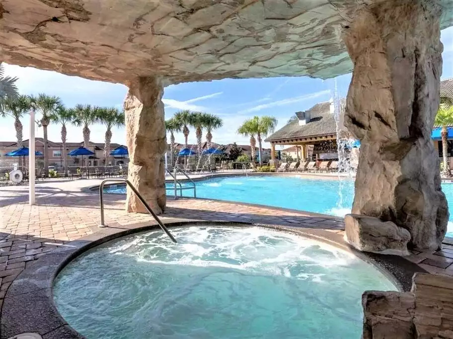 A shaded jacuzzi within the pool grotto A shaded jacuzzi within the pool grotto - Immersive Themes* Outdoor Pool & Movie* 5mi Disney - Kissimmee