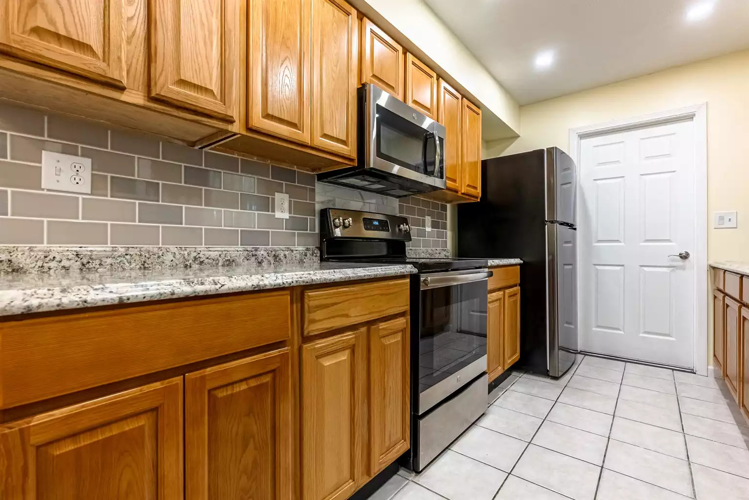 Door to garage which leads to patio with grill. Door to garage which leads to patio with grill. - Deb's Grand Lagoon 3 BR Home - Panama City Beach