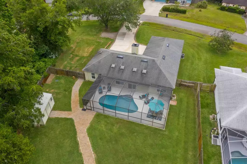 Aerial view of covered Heated Saltwater Pool and backyard. Aerial view of covered Heated Saltwater Pool and backyard. - Heated Saltwater Pool*Harry Potter*Fire Pit*BBQ*EV - St. Augustine