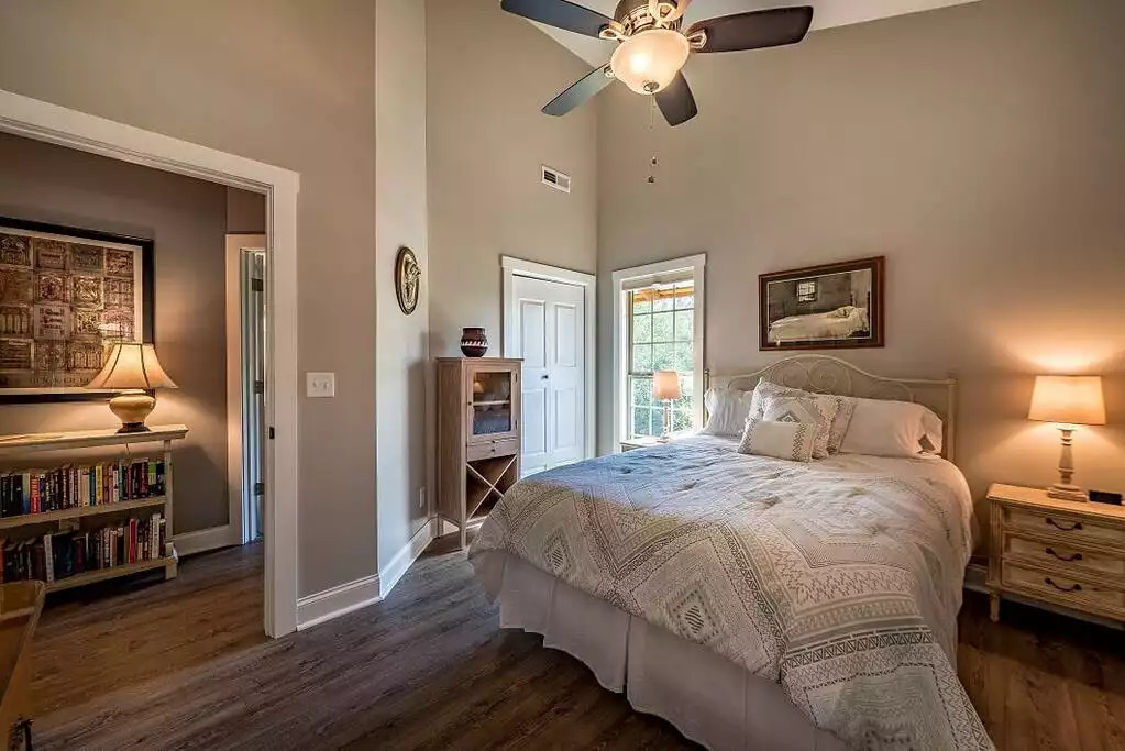 Bedroom 2, queen-size bed, cordless cellular shades. Note the "take one, leave one" book collection in the hallway. Bedroom 2, queen-size bed, cordless cellular shades. Note the "take one, leave one" book collection in the hallway. - Fox View Cottage - Rising Fawn