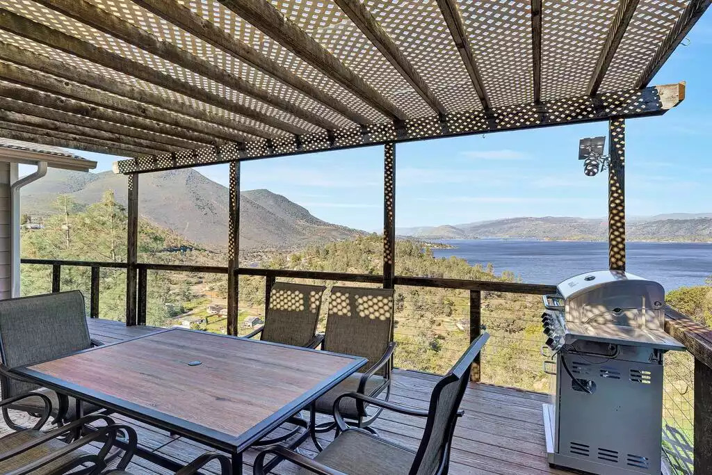 Relax in a wrap around deck with serene lake and Mt. Konocti view equipped with a grill, 6 seater dining table, a mini swing and a lounge chair. Relax in a wrap around deck with serene lake and Mt. Konocti view equipped with a grill, 6 seater dining table, a mini swing and a lounge chair. - NEW Unobstructed Lake/Mountain View home, movie rm - Kelseyville