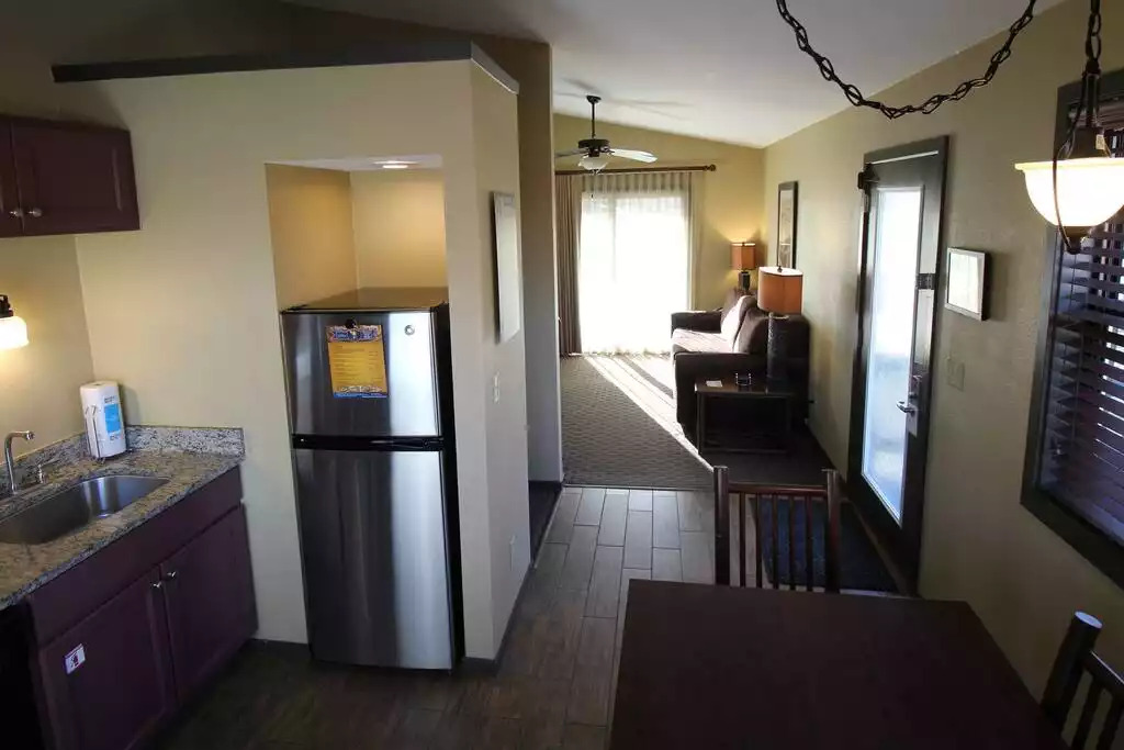 A view from the kitchen looking towards your private entry door and living room. Kitchen includes a table to seat 6, full sized appliances, including micro. Refrigerator has ice maker in freezer. All pots, pans, dishes, soap and linens included A view from the kitchen looking towards your private entry door and living room. Kitchen includes a table to seat 6, full sized appliances, including micro. Refrigerator has ice maker in freezer. All pots, pans, dishes, soap and linens included - Entire Cottage 1 Wisc Dells 2 Bed 1 Bath Sleeps 6 - Wisconsin Dells