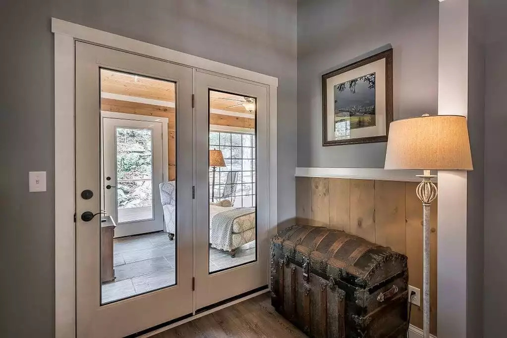 French door that leads to the sun-room and the backyard, off the great room. French door that leads to the sun-room and the backyard, off the great room. - Fox View Cottage - Rising Fawn