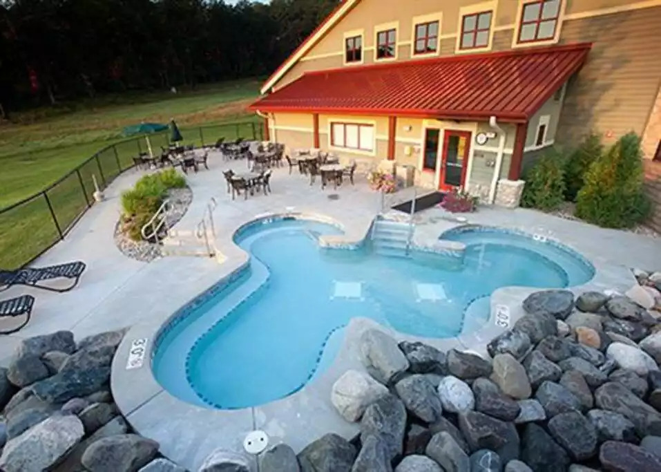 This outdoor Hot tub at the main building seats 39 guests, and is open year around, from 6 AM to 11 PM. All other hot tubs are open summer only, from 10 AM to 8 PM, weather permitting. This outdoor Hot tub at the main building seats 39 guests, and is open year around, from 6 AM to 11 PM. All other hot tubs are open summer only, from 10 AM to 8 PM, weather permitting. - Entire Cabin 1 Wisc Dells 3 Beds(2Bedrooms) 2Baths - 63 Christmas Mountain Road