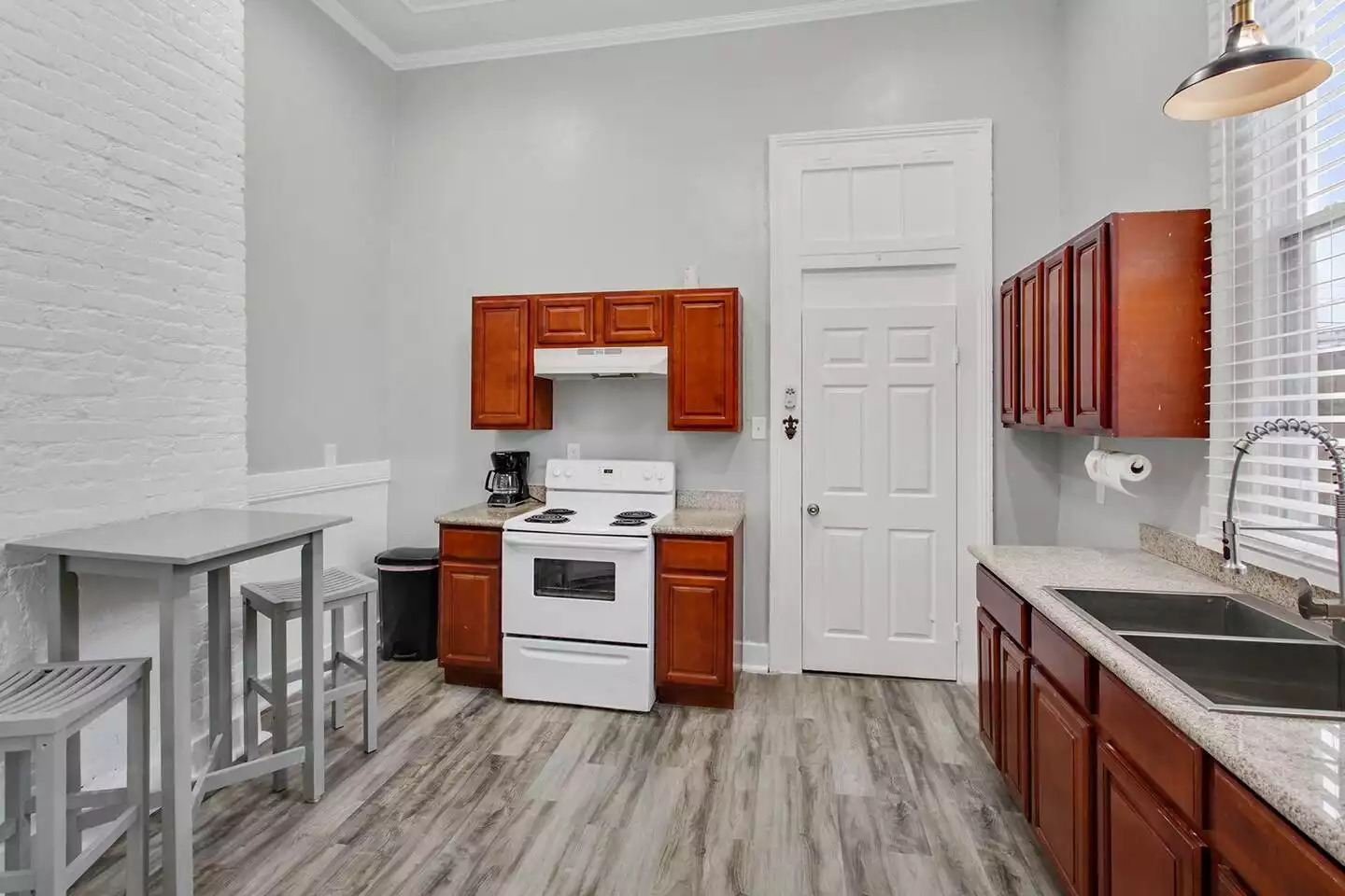 Kitchen - door to bedroom 2. Kitchen - door to bedroom 2. - Unit 1 – Charming Authentic Mid City! - New Orleans