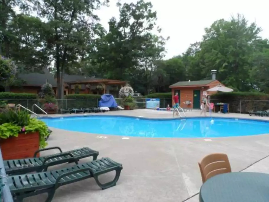 One of 4 outdoor pools open all summer. Pergola next to outdoor pools contains outdoor charcoal grills and picnic tables. Perfect spot for cooking outside, besides the grill on your screened in deck. All grilling utensils included in your cabin. One of 4 outdoor pools open all summer. Pergola next to outdoor pools contains outdoor charcoal grills and picnic tables. Perfect spot for cooking outside, besides the grill on your screened in deck. All grilling utensils included in your cabin. - Entire Cabin 1 Wisc Dells 3 Beds(2Bedrooms) 2Baths - 63 Christmas Mountain Road