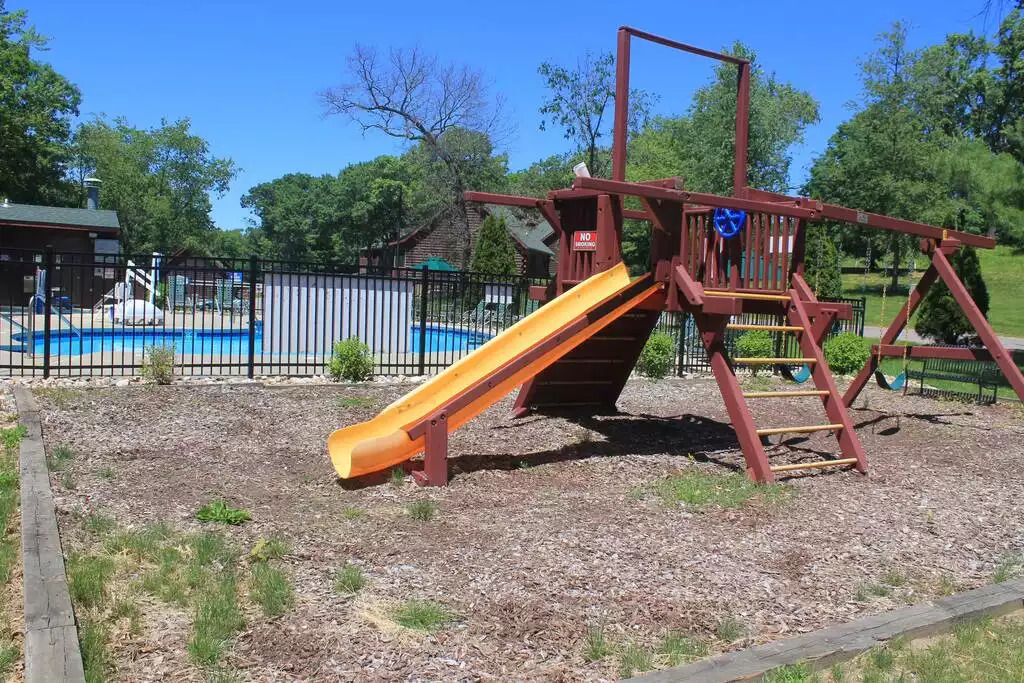 This play area is walking distance to your cabin and just outside the pool area. Gorgeous blue skies and plenty of trees await your stay! This play area is walking distance to your cabin and just outside the pool area. Gorgeous blue skies and plenty of trees await your stay! - Entire Cabin 1 Wisc Dells 3 Beds(2Bedrooms) 2Baths - 63 Christmas Mountain Road
