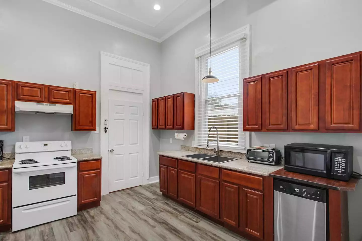 Well lit kitchen. Folding table and additional chairs on site. Well lit kitchen. Folding table and additional chairs on site. - Unit 1 – Charming Authentic Mid City! - New Orleans