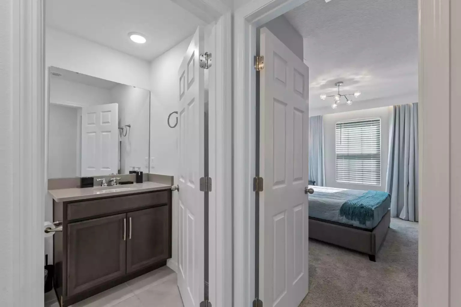 Full bathroom with walk in shower, large mirror and vanity. Full bathroom with walk in shower, large mirror and vanity. - Luxury Vacation Home Minutes From Disney World - Kissimmee