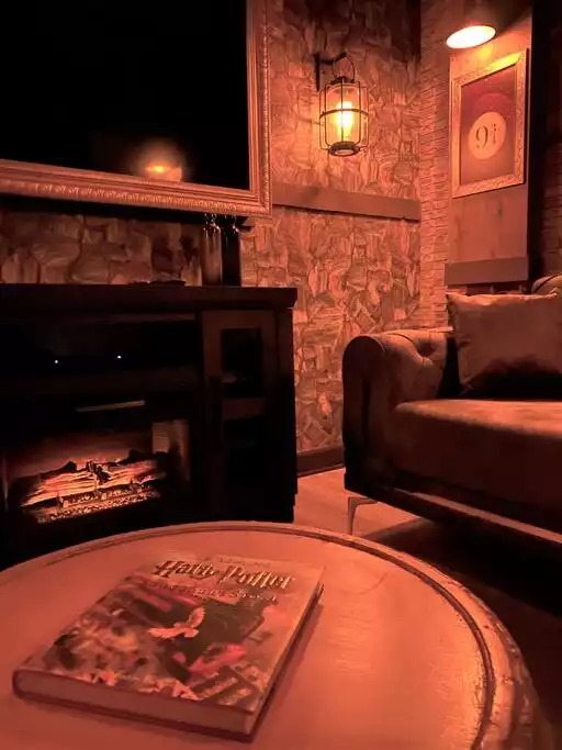 Curl up next to the fireplace with a good read, "Harry Potter and the Sorcerer's Stone". Curl up next to the fireplace with a good read, "Harry Potter and the Sorcerer's Stone". - Immersive Themes* Outdoor Pool & Movie* 5mi Disney - Kissimmee