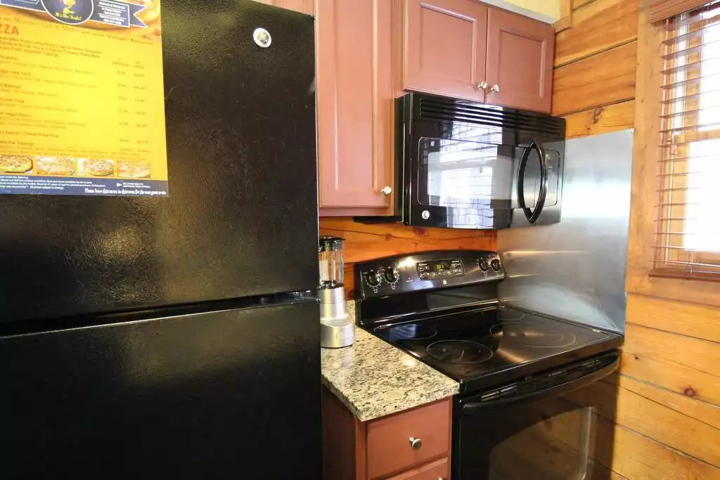 This equipped kitchen includes utensils, dishes, glasses for six guests as well as cookware, blender, toaster, towels and dish soap. With groceries available to purchase locally, you can cook all of your meals here, or go out. Options are good! This equipped kitchen includes utensils, dishes, glasses for six guests as well as cookware, blender, toaster, towels and dish soap. With groceries available to purchase locally, you can cook all of your meals here, or go out. Options are good! - Entire Cabin 1 Wisc Dells 3 Beds(2Bedrooms) 2Baths - 63 Christmas Mountain Road