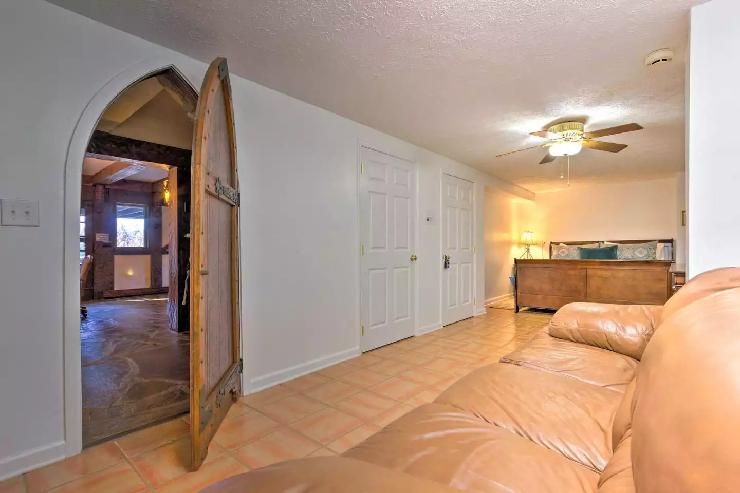 Another king-sized bed awaits on the other side of the castle-style door! Another king-sized bed awaits on the other side of the castle-style door! - Leaping Fawn Lodge - Waynesville