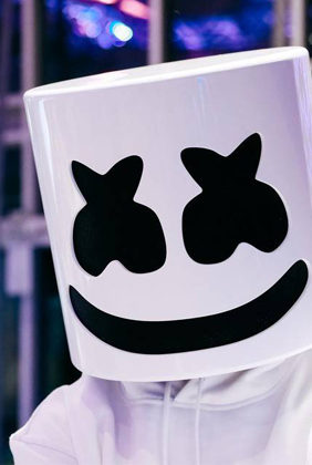 Marshmello dj wearing white hoodie in convention center